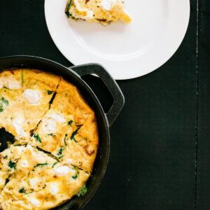 Cast iron skillet holding a baked frittata