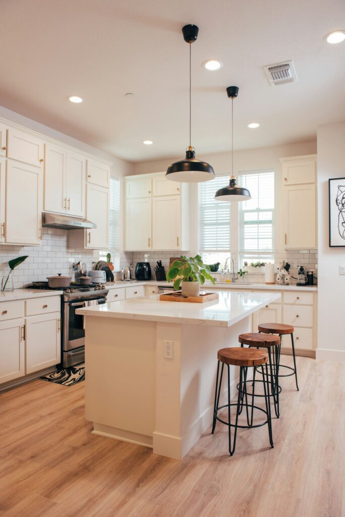 Bright farmhouse kitchen with a central island and bar stools