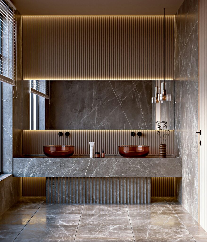 Marble bathroom with a double vanity and backlit mirror